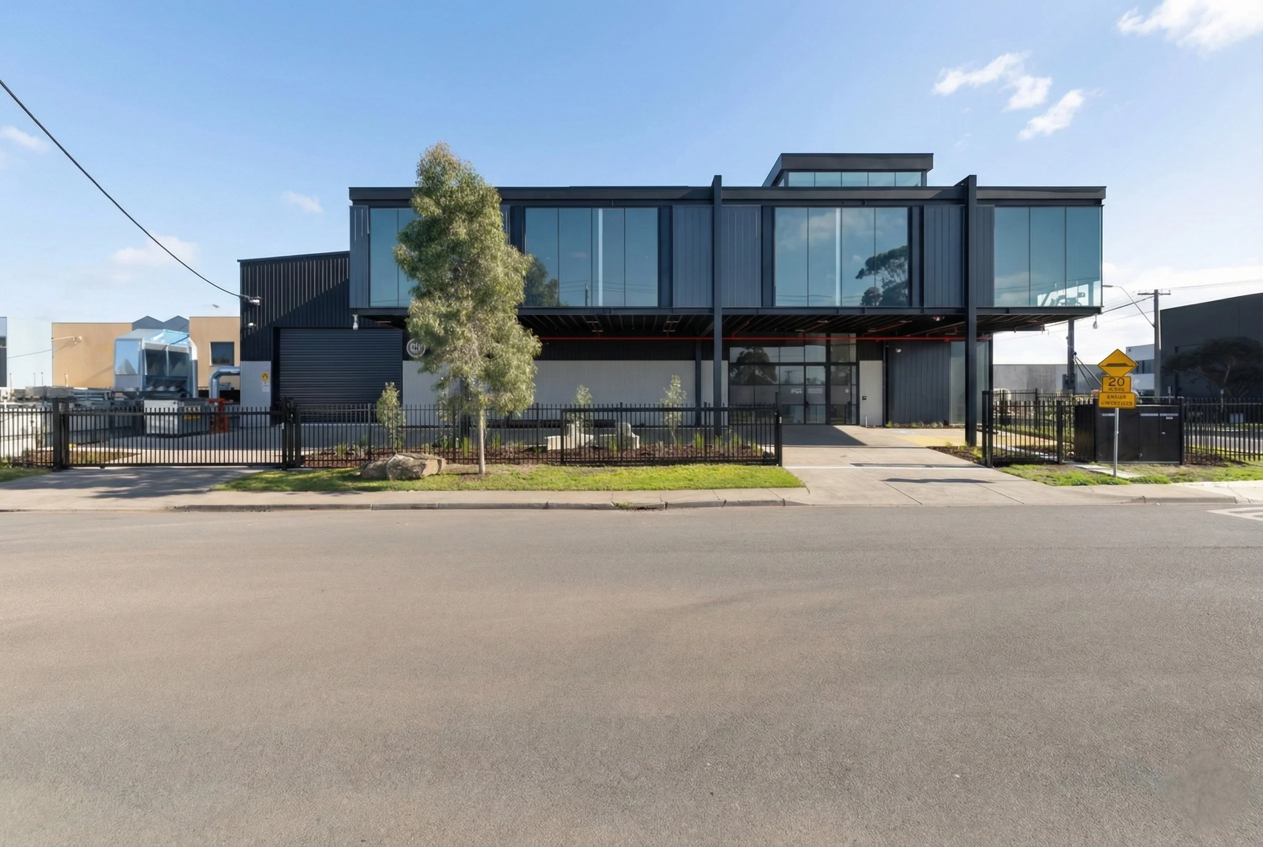 11 Churchill Street office addition in Williamstown showcasing elevated workspace design above factory floor